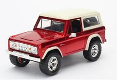 1973 Ford Bronco, red with white roof.